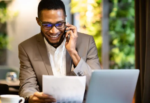 An agent working a deal by phone